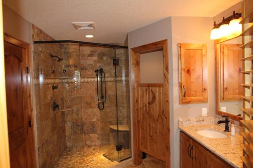 Stone Walk-in Shower with Dual Shower Heads