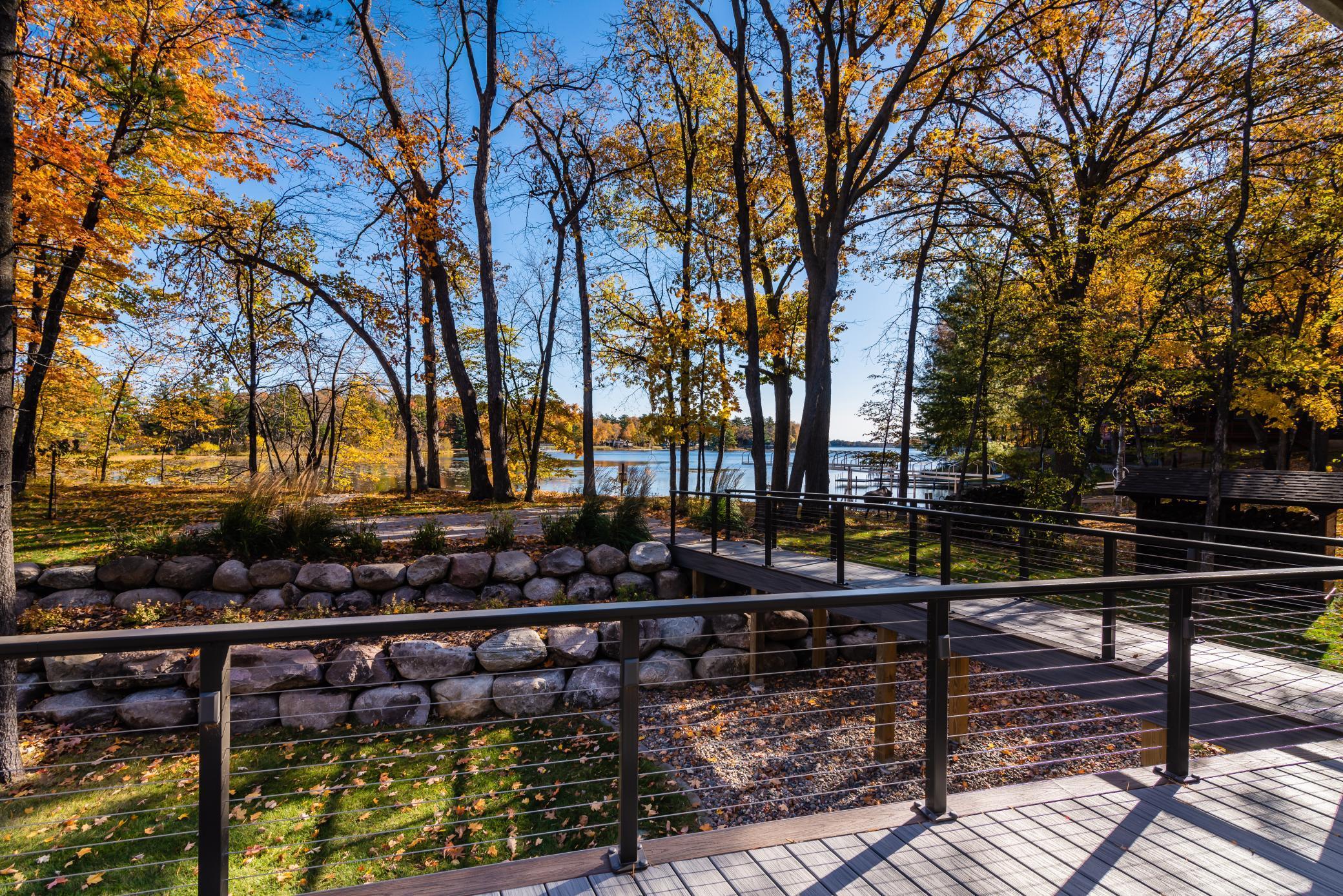 Guest house lakeside deck with charming bridge to the lake!