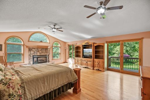 Upper level master bedroom suite with gas fireplace, vaulted ceilings and private balcony to have your morning coffee.