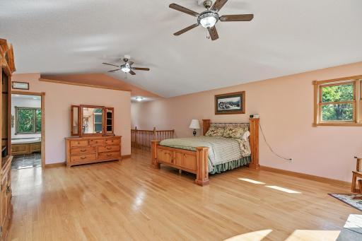 Master bedroom with hardwood floors, walk-in closet and private master bath.