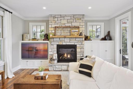 Family room offers fireplace, cabinetry and opens to Screened Porch