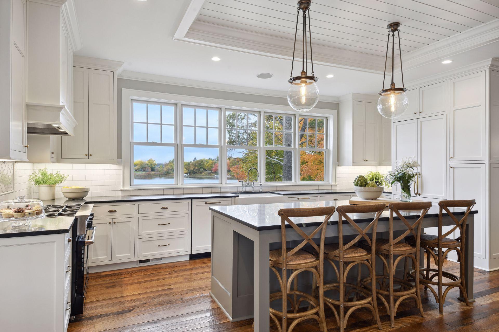 Reclaimed hardwood floors, center island, abundance of cabinetry with Soapstone counters