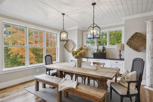 Kitchen opens to dining room with built-ins