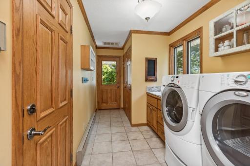 There is a quarter bath and laundry area upon entering the home from the oversized two-car garage that is insulated.