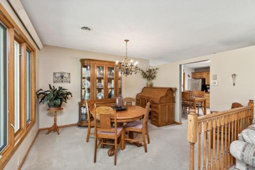 There is both an in-kitchen dinette area and adjacent dining room with antique chandelier.