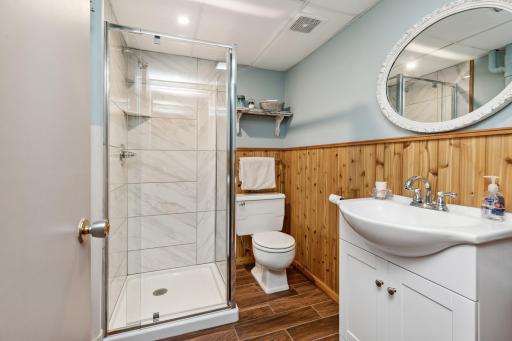 There is a 3/4 bath with ceramic tile floors, and two unfinished areas in the lower level of the home.