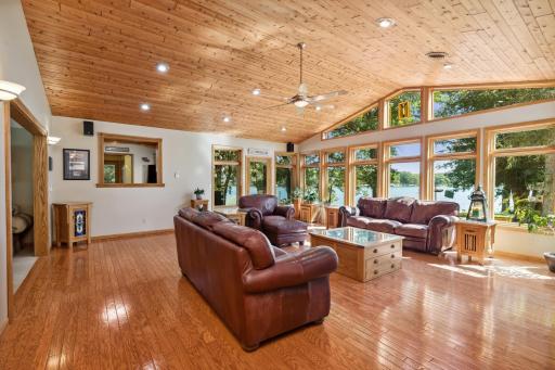 A beautiful sprawling rambler is nestled near the shoreline with A-frame epic picturesque views from all angles in the great room.