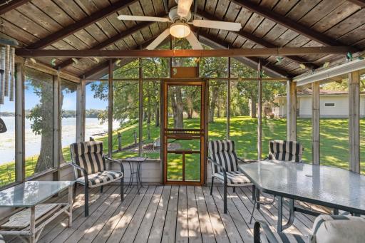 A quaint primitive lake house (aka the “Love Shack”) down by the water with screened-in porch and seasonal living area.