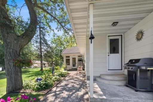 Charming patio with lovely perennials and plantings. A bird watcher's paradise.
