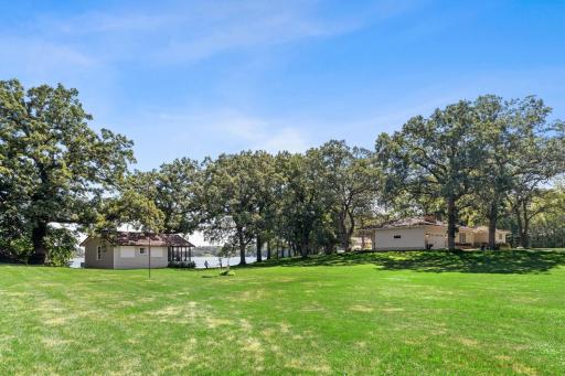 Fun facts/yard: Over 20 beautiful oak trees 60’ tall | Hybrid Willows along road | Paver patio | Perennial gardens | Fenced-in garden