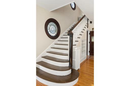 4639 Fremont Ave S - Stunning staircase with 2 round leaded-glass windows.