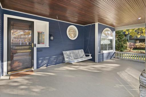 4639 Fremont Ave S - Enjoy your neighborhood from the porch swing! Note the round and half-moon leaded windows.