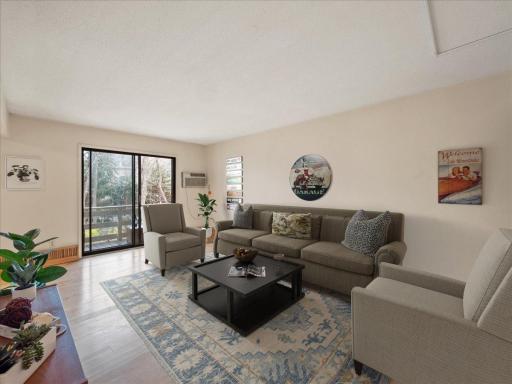 Virtual staged living room area. Great lighting!