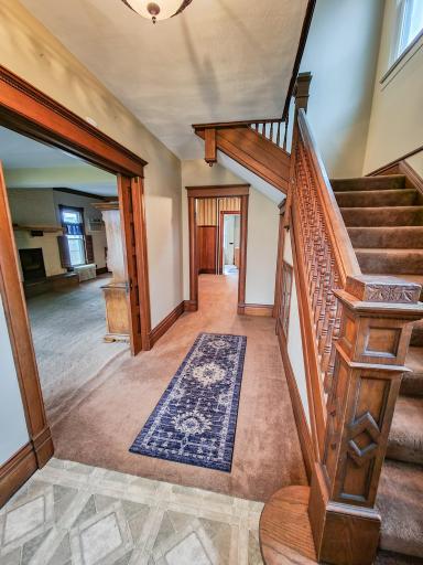 Welcoming front entrance with beautiful and original wood work