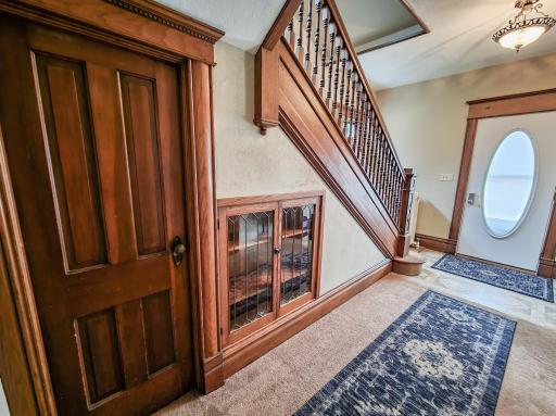Coat closet under staircase