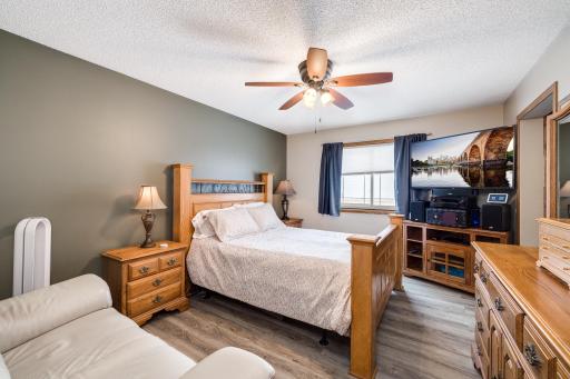 Photo for 8251 169th Street W, Lakeville, MN 55044 - Listing #6307744 Primary bedroom with remodeled walk-in closet and ensuite. Luxury vinyl plank flooring and ceiling fan installed. The primary bedroom has room for oversized furniture. The window treatment is new.