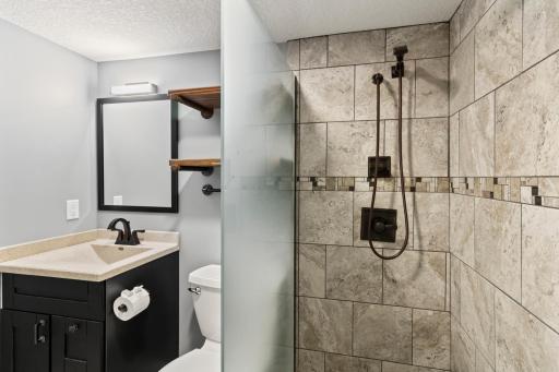 Bathroom with tiled shower - basement