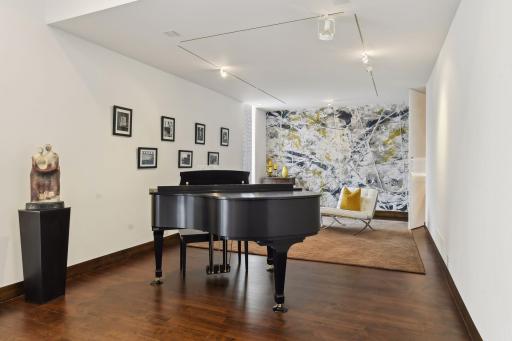 The music room sets the tone as you enter the home.