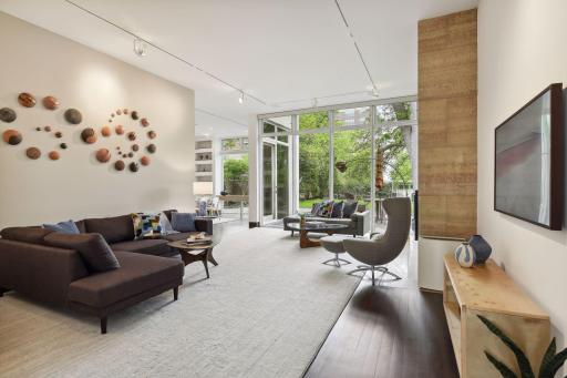 From the foyer the home opens all the way through to the large yard beyond.