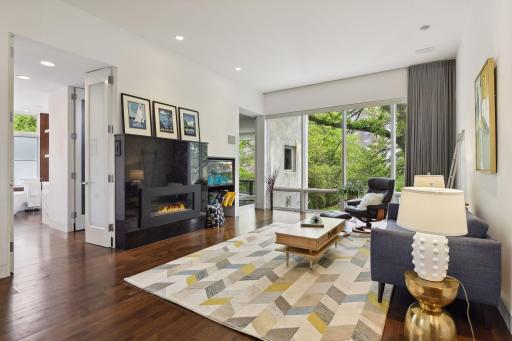 Primary Suite features this sitting area, a built in desk and shelves as well as the bedroom, 2 walk-in closets and the private spa like bath.