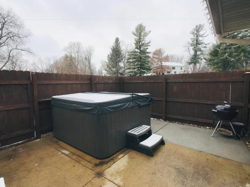 Large concrete patio with new hot tub.jpg