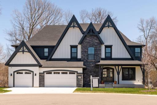 Come home to this FABULOUS custom home located in The Woods on Halstead's Bay!