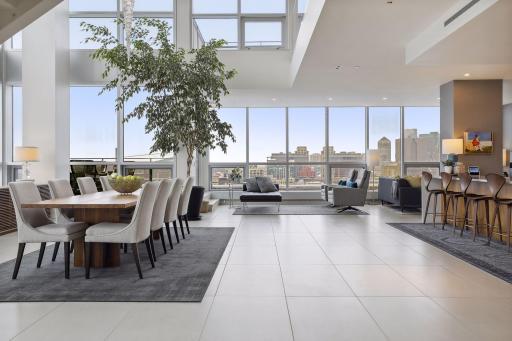 Dining, kitchen, and lounge area with views to the south and east. A large outdoor terrace at the SE corner is easily accessed through french doors from the lounge area.