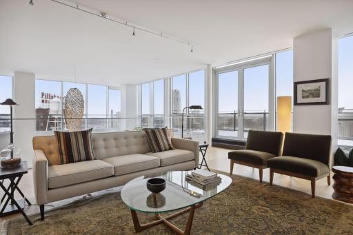 A set of french doors leads to the terrace on the upper level which also features river views, panoramic city skyline views, and a perfect perch for watching seasonal fireworks.