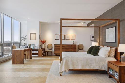 Upper level primary bedroom suite with solid black ash herringbone floors.