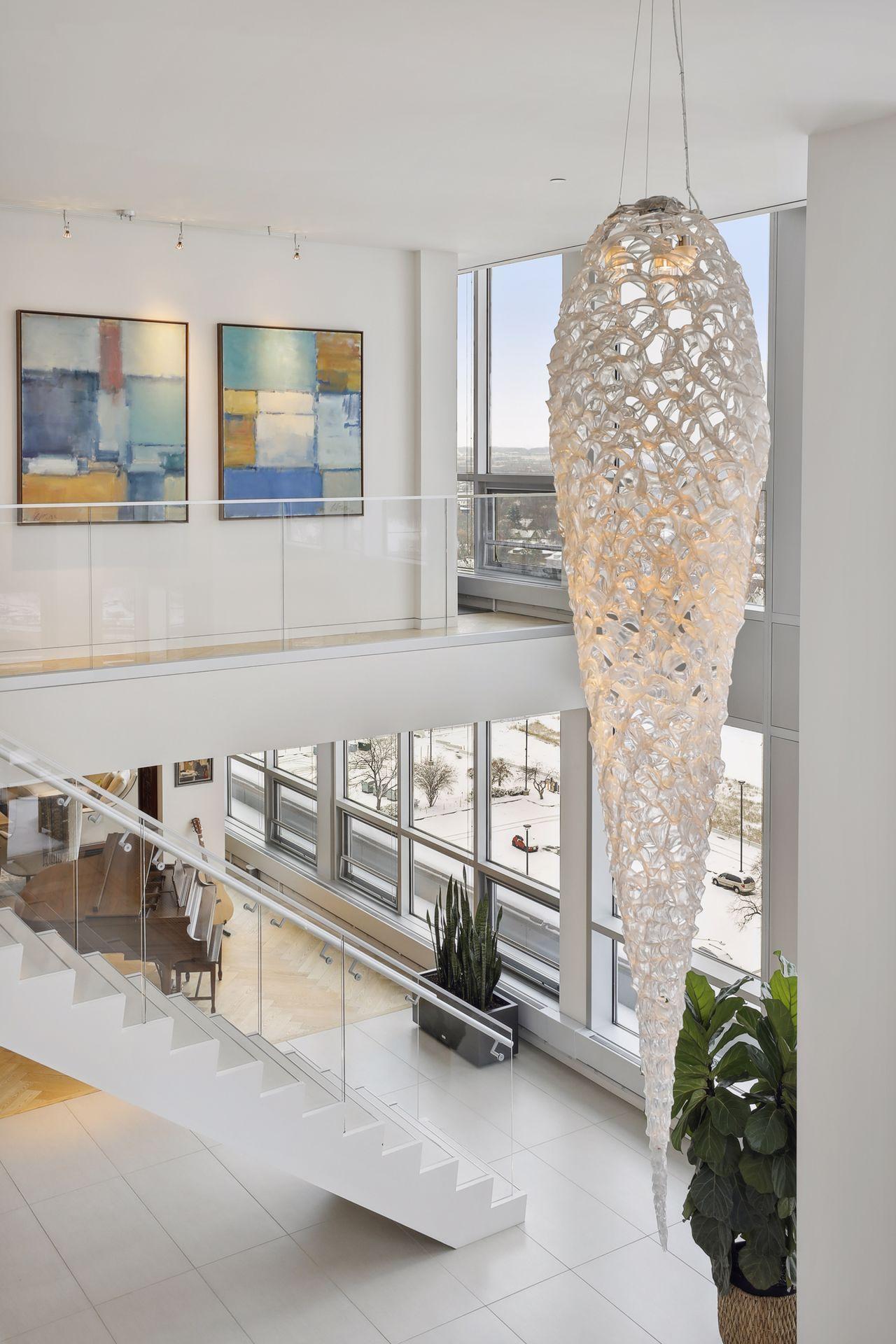 The spectacular chandelier is a custom design made of recycled Ferrari headlights and manufactured by a member of the Ferrari family.