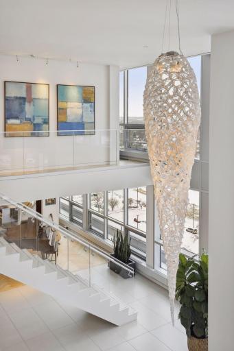 The spectacular chandelier is a custom design made of recycled Ferrari headlights and manufactured by a member of the Ferrari family.