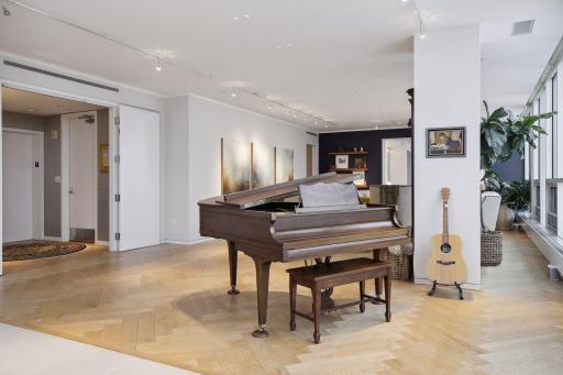 The main entry foyer features a private elevator and a wide doorway leading into the formal living area.