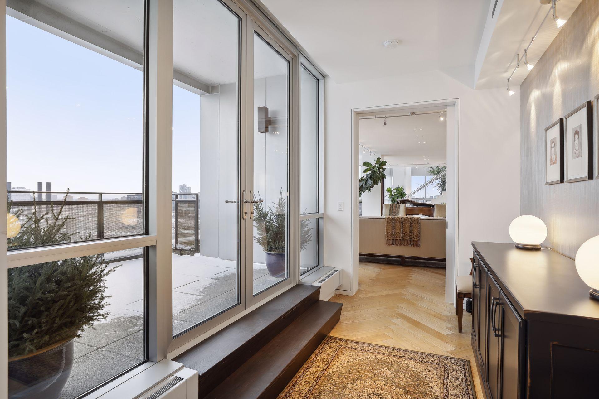 The main level bedroom features its own terrace. This home enjoys four outdoor terraces.