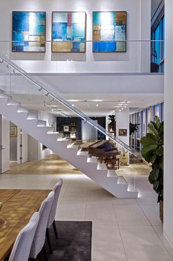 Custom lighting throughout the home to suit every mood including an illuminated floating staircase.