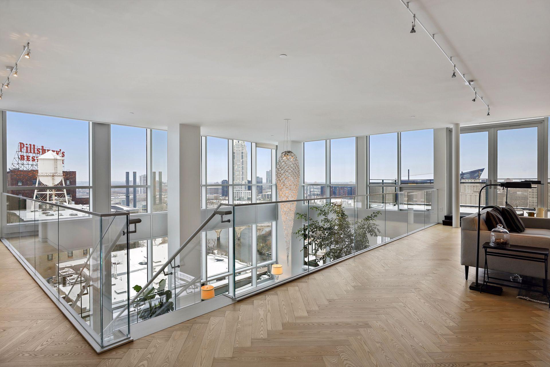 Extraordinary views from the upper level library and den through two stories of windows.