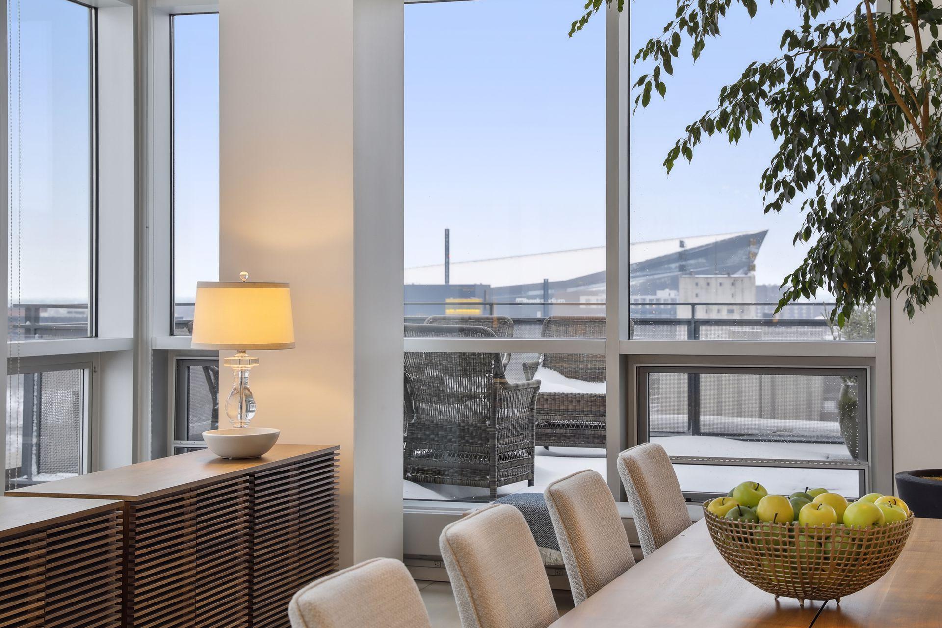 Dining room views to the South and East. One of four outdoor terraces is located adjacent to the dining, lounge, and kitchen areas.