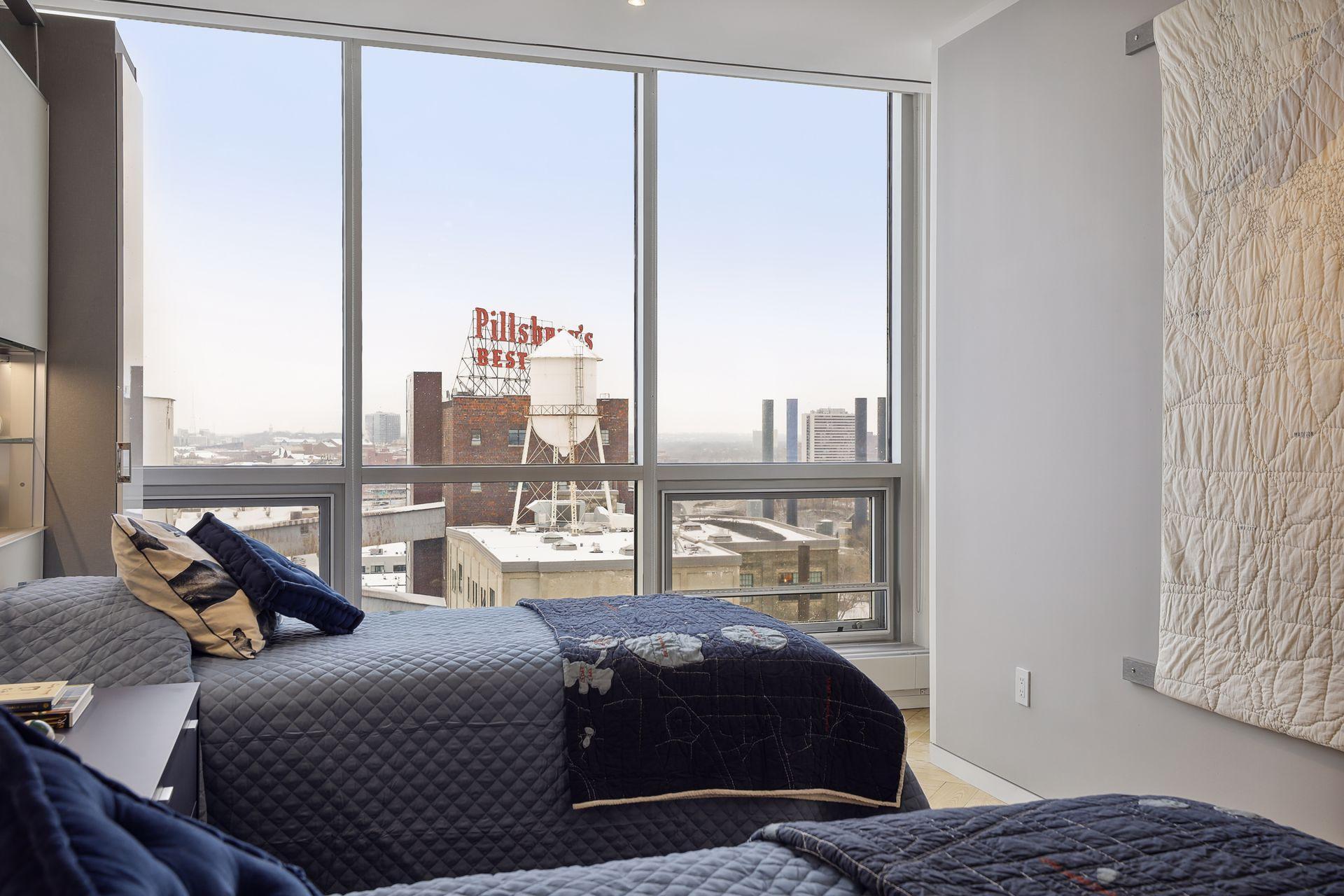 Big sky and historic flour mill views from the guest bedroom. A 3/4 guest bath across the hall serves this 3rd bedroom and the upper level library/den.
