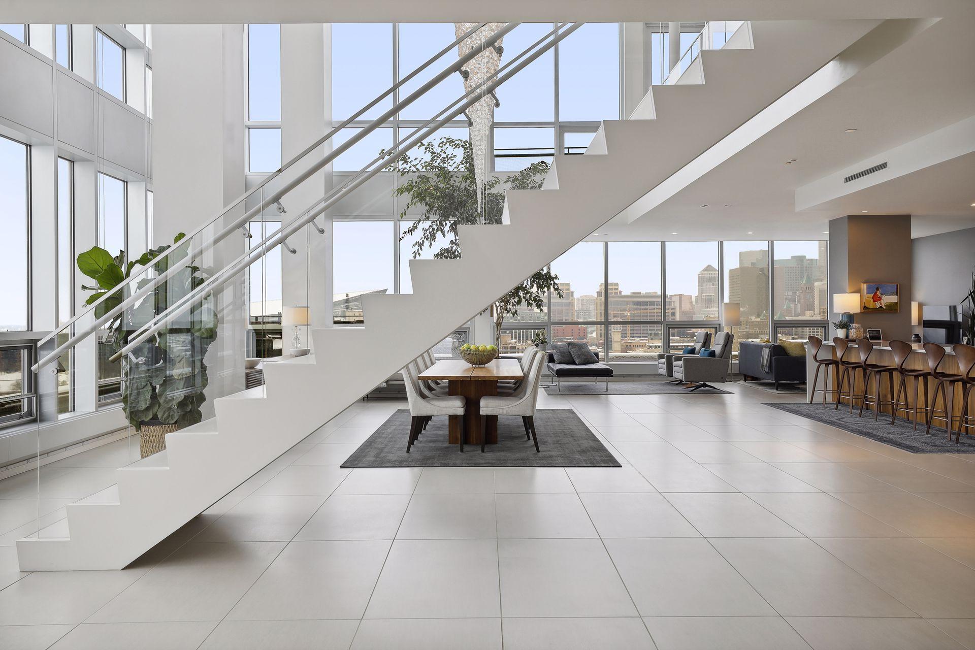 Light-filled living spaces with two-story windows and views in all directions.