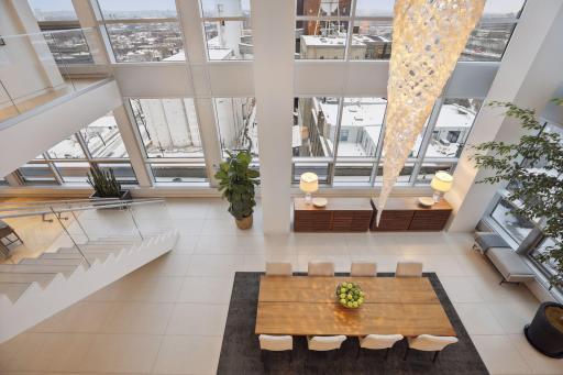 View of the formal dining area from the upper level library and den.