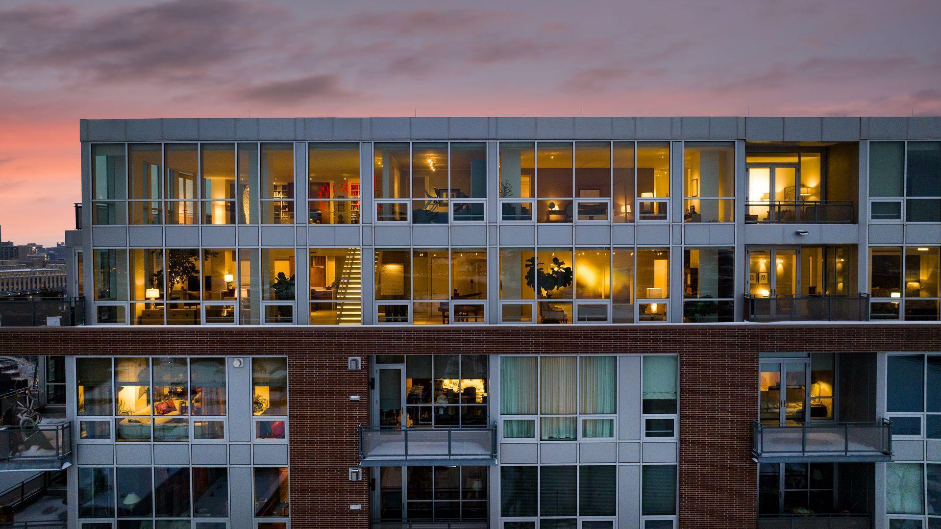 Penthouse #1703 at The Phoenix on the River. Amenities include a 24/7 desk attendant, fitness room, party room with a large outdoor terrace facing the river, conference room, wood shop, craft room, indoor guest parking, security, and dry cleaning.