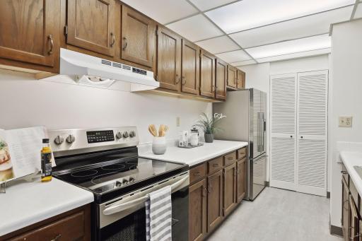 New flooring adds style and beauty. Find abundant cabinetry to store your kitchen staples and cookware. There is a walk-in pantry with wire shelving for additional storage too!