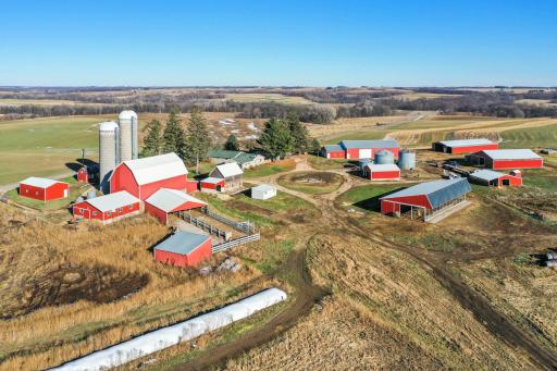 Featuring two homes, numerous outbuildings for chickens, pigs, or other small animals, a new 70 X 70 riding arena, and a dairy barn - all milking equipment still on site!