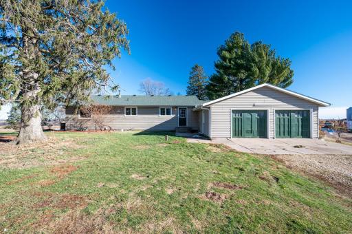 First home consists of 4 bedrooms, 2 bathrooms, 2-car attached garage, a large kitchen, dining room, living room, and an unfinished basement.