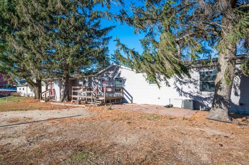 House #2 is a manufactured home featuring a front deck, and 2 entrances.