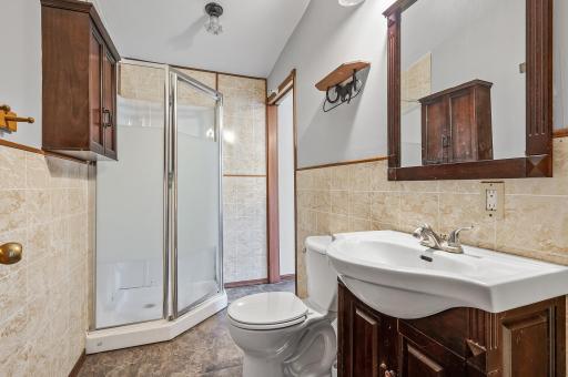 Three-quarter bathroom with walk-in shower stall in house #2.
