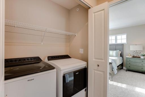 Upstairs laundry for your convenience! Photo of end unit model, colors are similar.