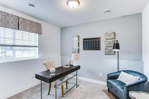 Lower-level flex room can be used to best suit your lifestyle - office, playroom, home gym, cozy den, guest room, or whatever else you envision! Photo of end unit model, colors are similar.