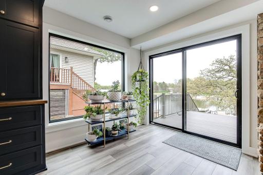 Dining Area with 2 Sliders out to the decks and easy access to the beach/lake area.