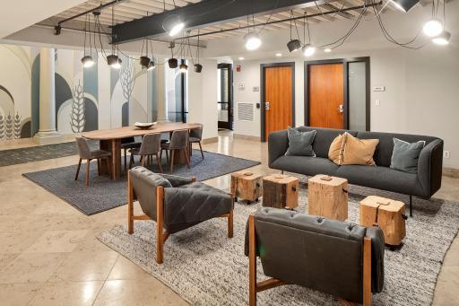 Lovely gathering space with a fireplace in the building's entry.