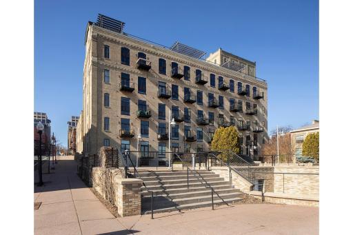 Back of the building includes a patio shared with the public.